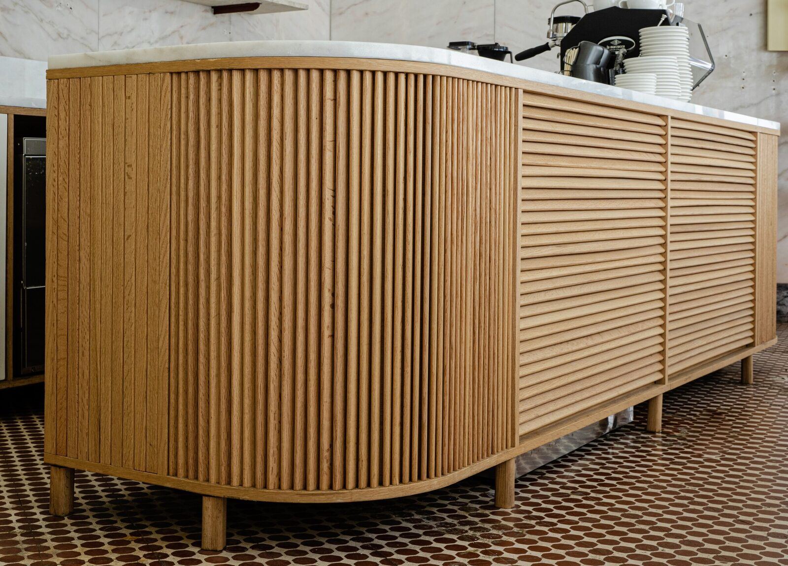 TACT, Lisbon: curved counter in solid oak slats