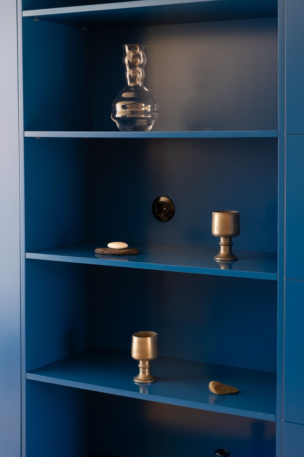 Blue shelves with brass objects, Blue Cabinet