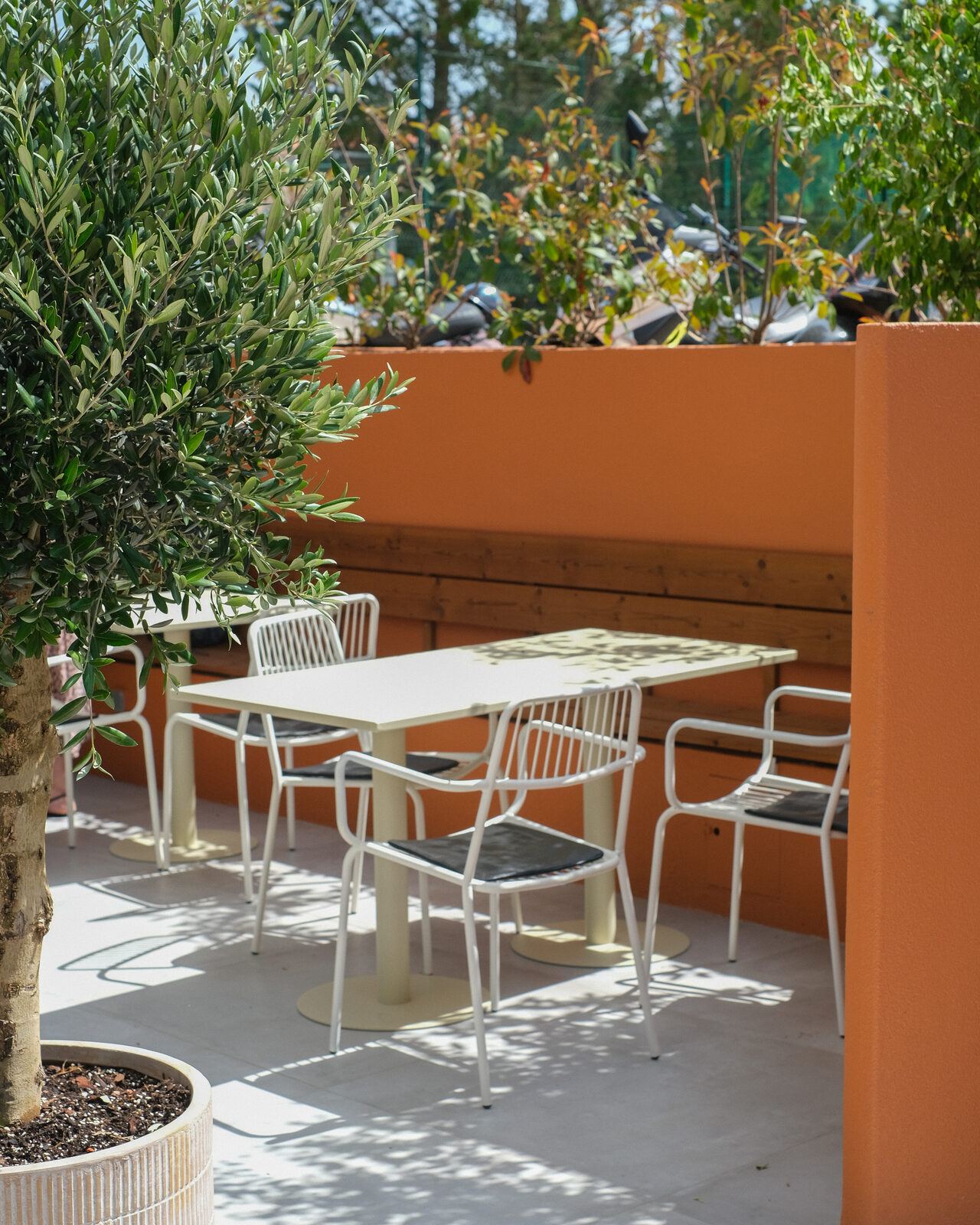 Terrace with thermo-pine benches and orange walls, ULU