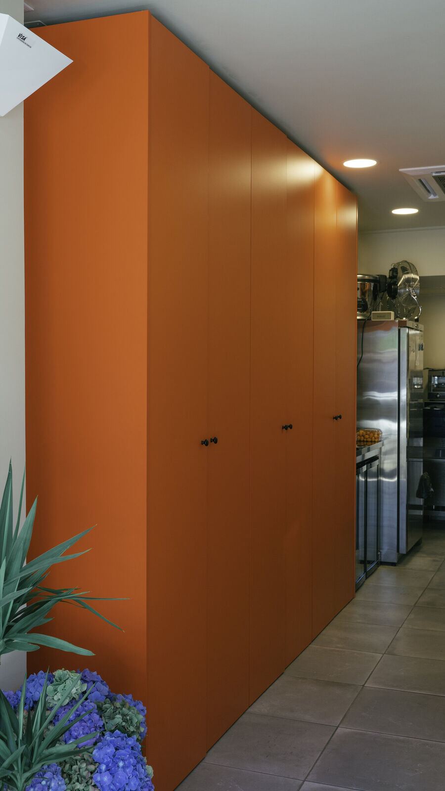 Tall orange staff cabinets, Sushiba