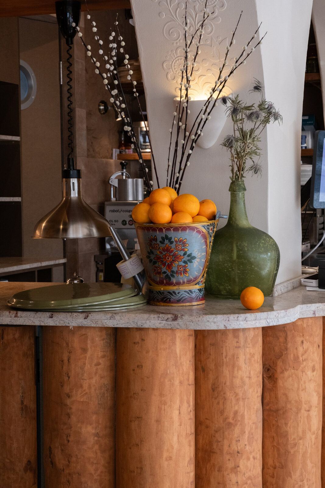 Counter corner with oranges, Usha