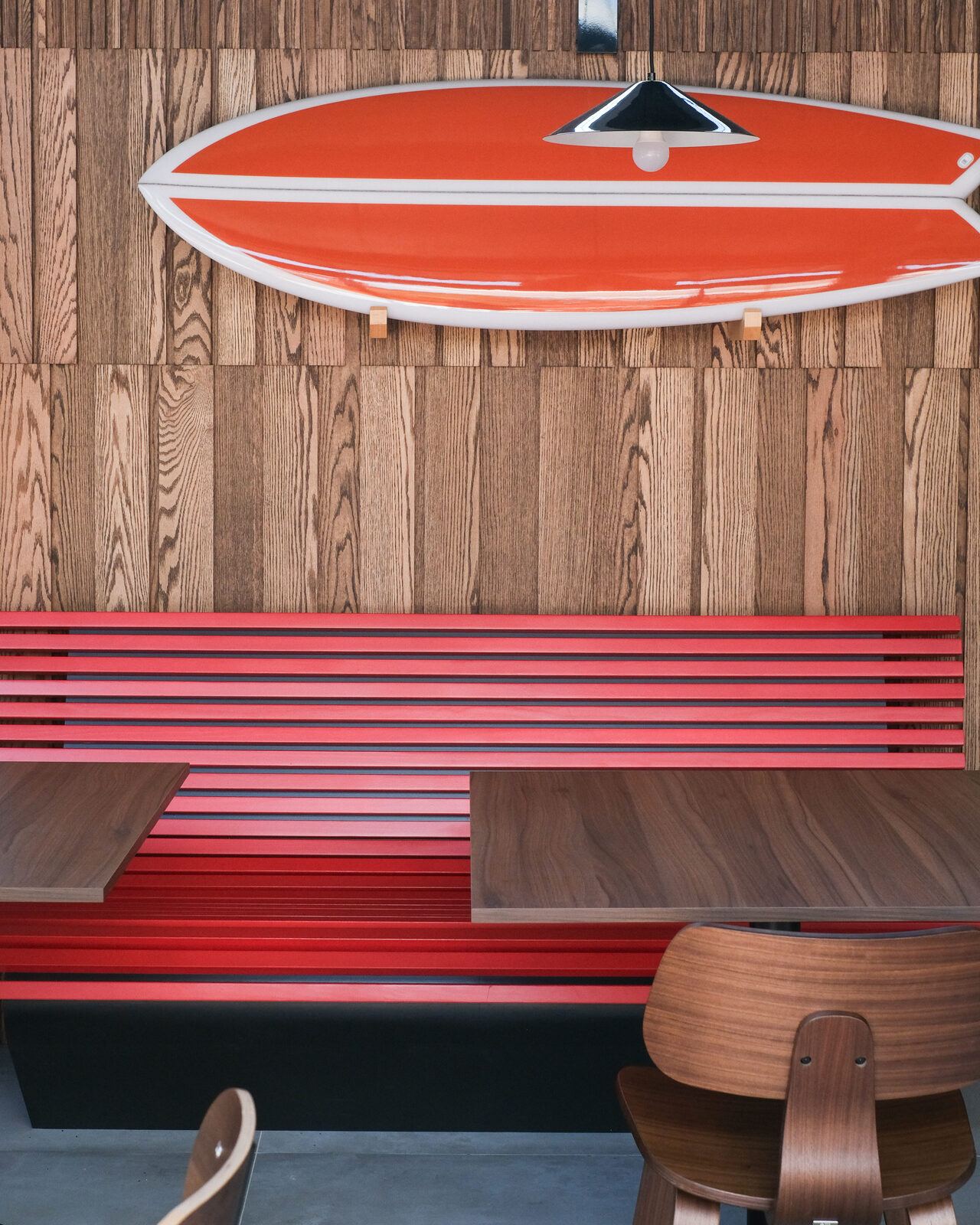 Red bench under the surfboards, ULU