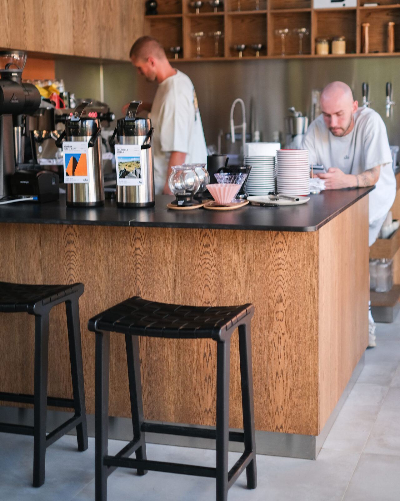 Baristas behind the oak bar, ULU