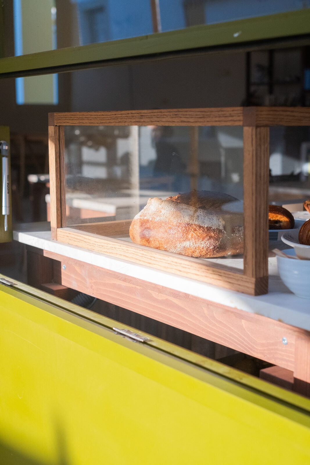 Display case seen through the painted window frame, DOMA