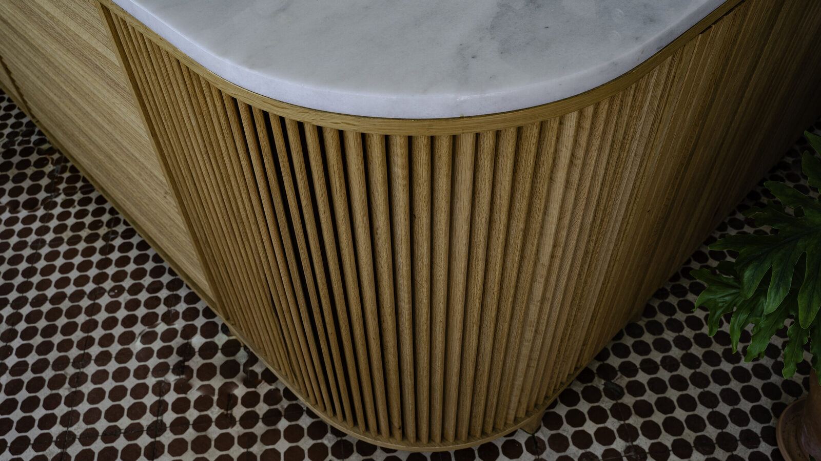 Oak slats following the curve of the counter, TACT