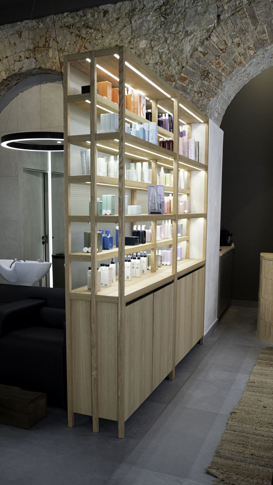 Cut & Shout, Lisbon: lit oak shelving